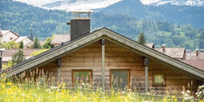 Hotels und Ferienwohnungen im Oberallgäu - Alpenhaus Oberstdorf - Außenansicht (Sommer) - ALPENHAUS Oberstdorf