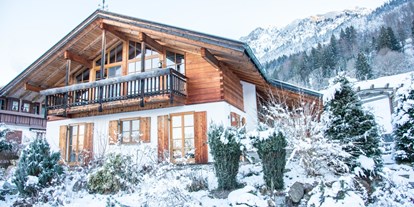 Hotels und Ferienwohnungen im Oberallgäu - Unterkunftsart: Chalet / Ferienhaus - Deutschland - Alpenhaus Oberstdorf - Außenansicht (Winter) - ALPENHAUS Oberstdorf
