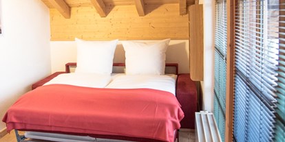 Hotels und Ferienwohnungen im Oberallgäu - Alpenhaus Oberstdorf - Schlafsofa App. 402 | weitBLICK - ALPENHAUS Oberstdorf